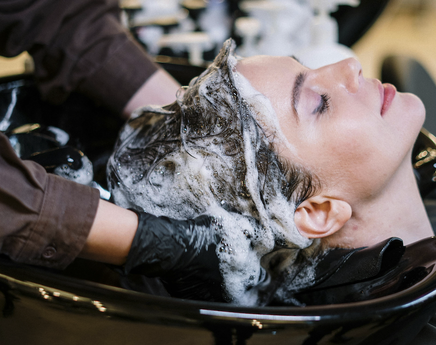 Woman getting her hair washed
